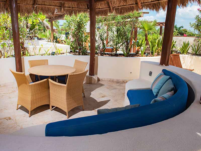 Porto Playa Condo 207 exterior with garden walkway and palm trees