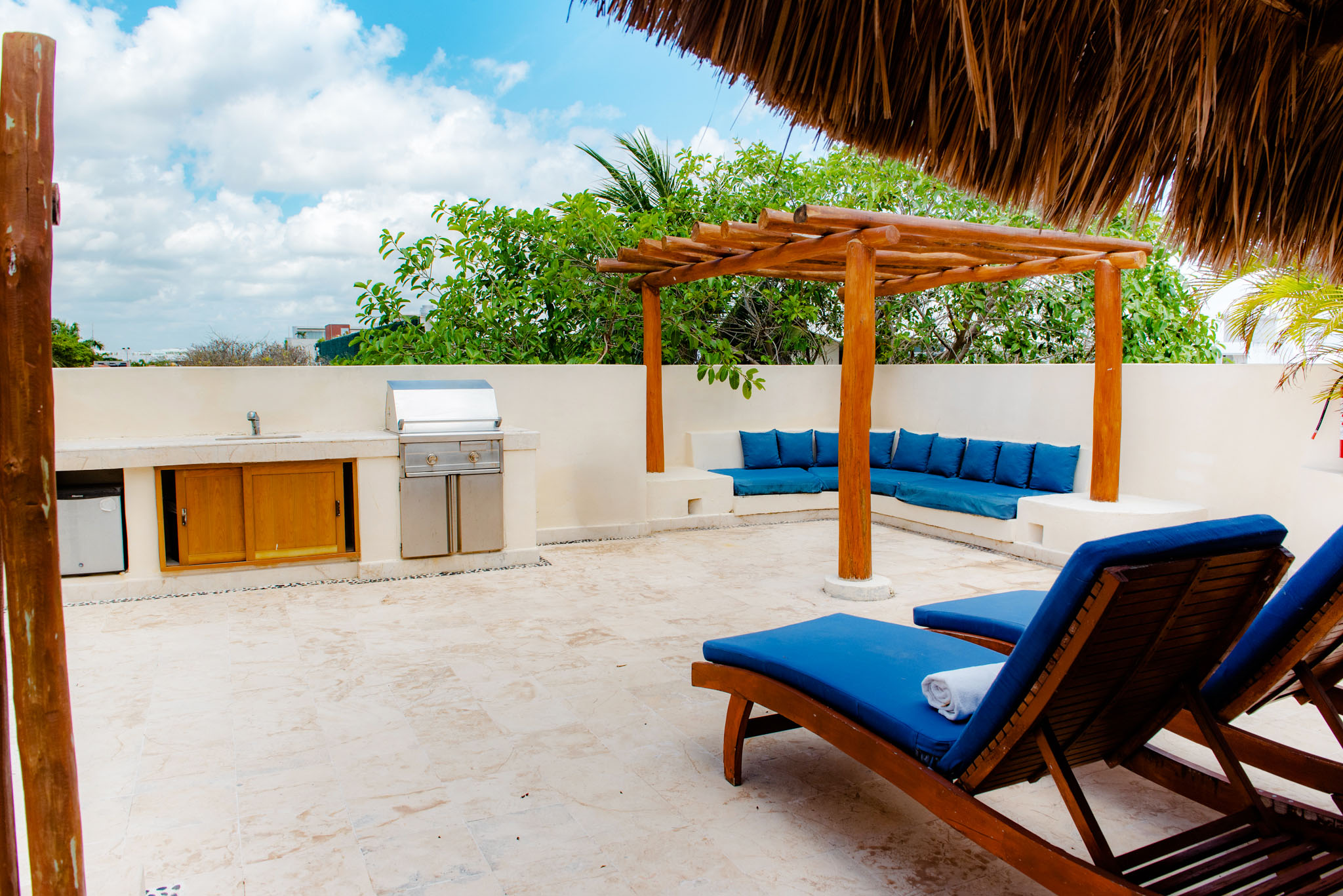 Fitness center with modern equipment and tropical views