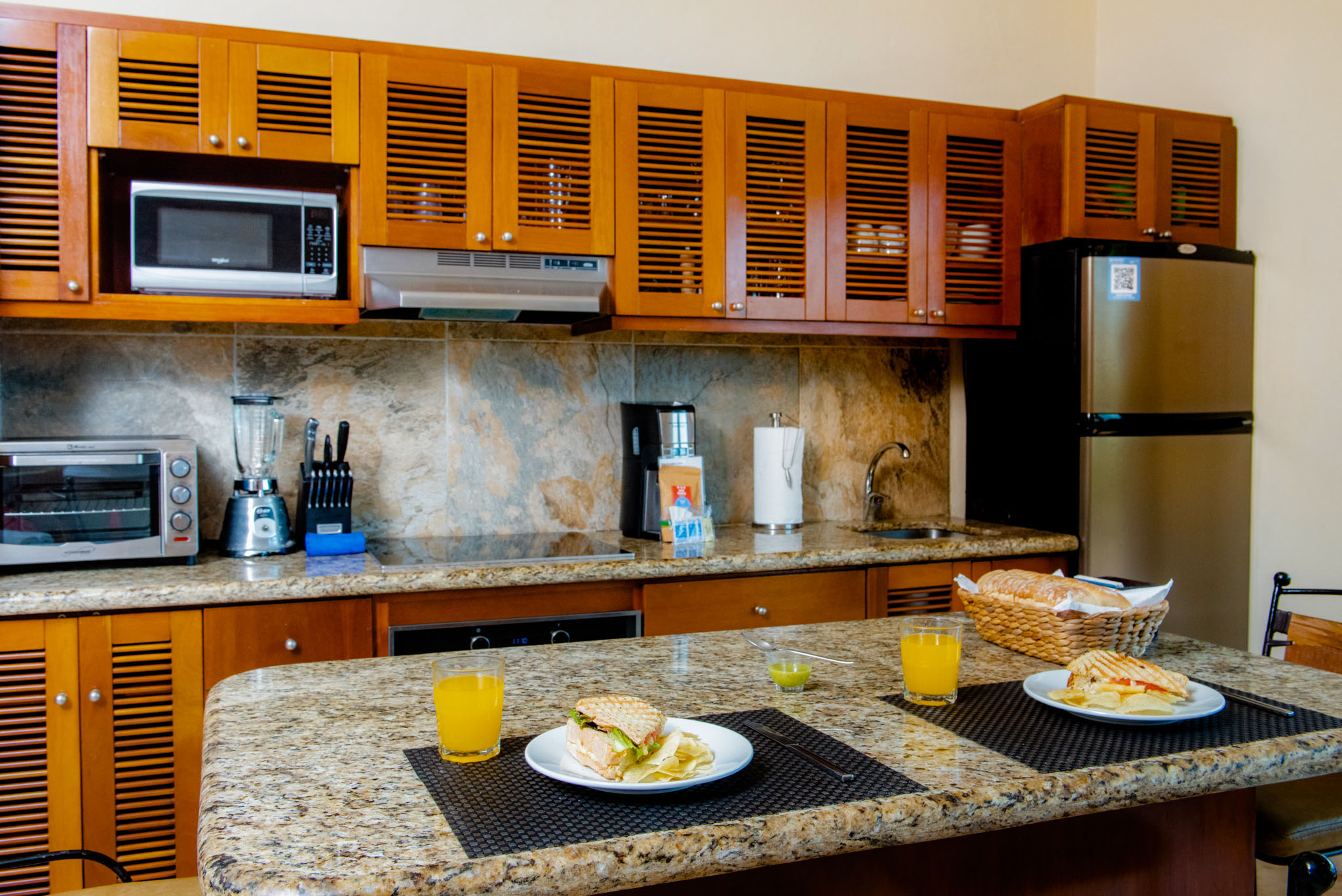 Spacious master bedroom with king bed and tropical ambiance